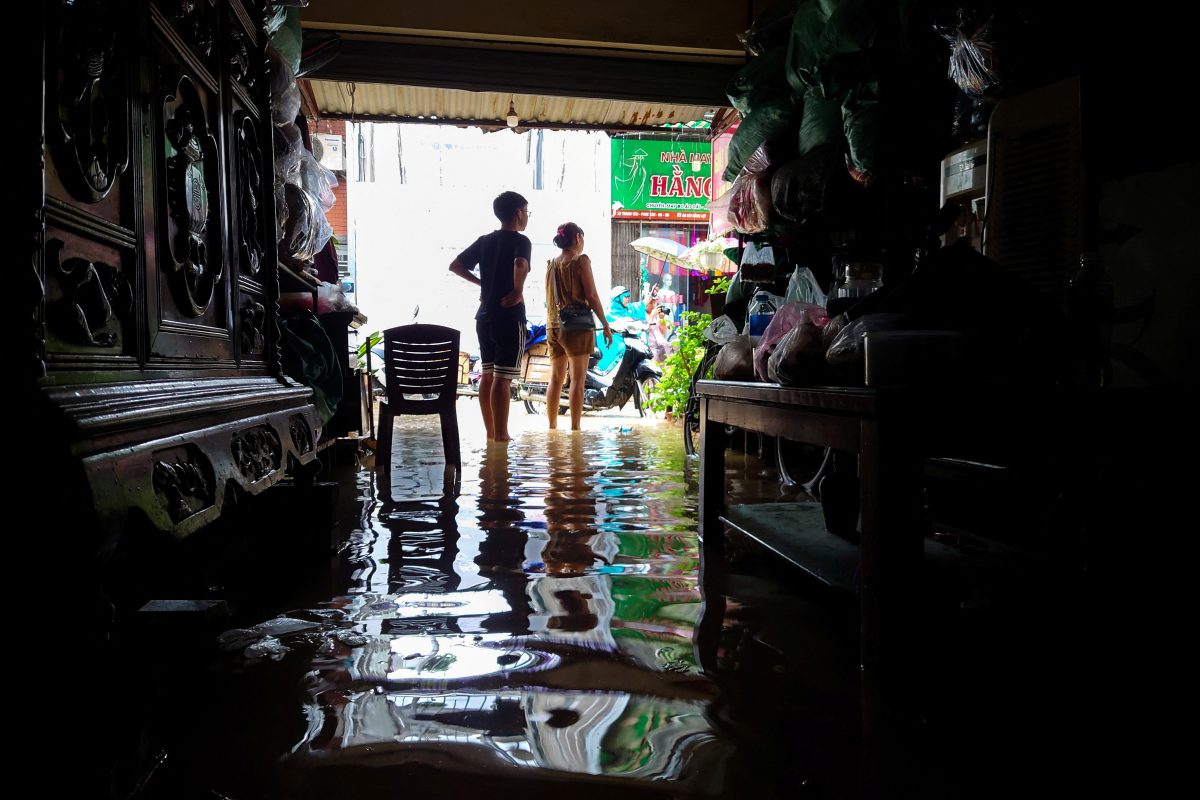 Shop owners stand inside their flooded shop following the impact of Typhoon Yagi, in Hanoi, Vietnam, September 11, 2024. REUTERS/Khanh Vu