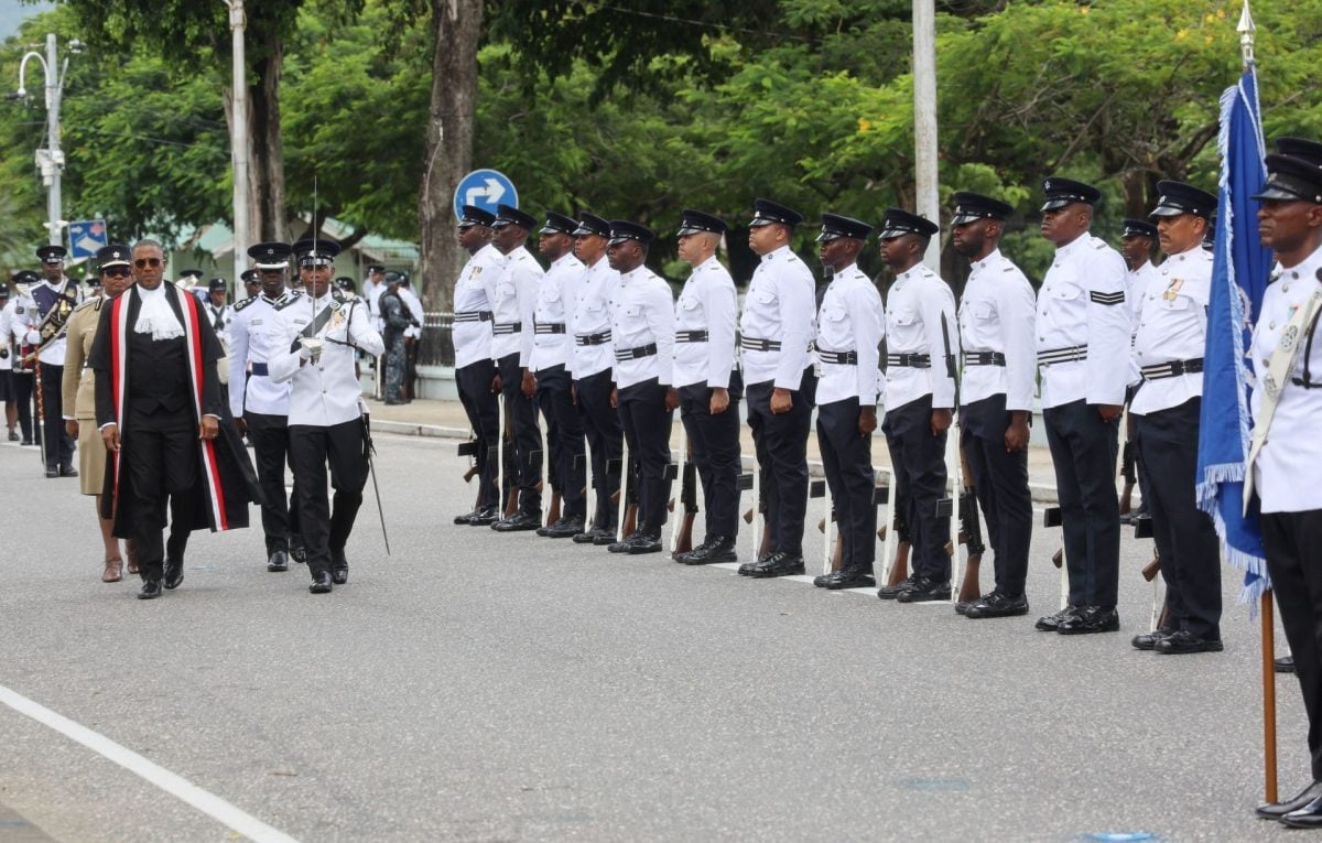 Chief Justice Ivor Archie, left, inspects the Guard of Honour at the commemoration of the opening of the 2024-2025 Law Term at the NAPA, Port-of-Spain, yesterday. Escorting the CJ are Commissioner of Police Erla Harewood-Christopher and Deputy Commissioner of Police Junior Benjamin.