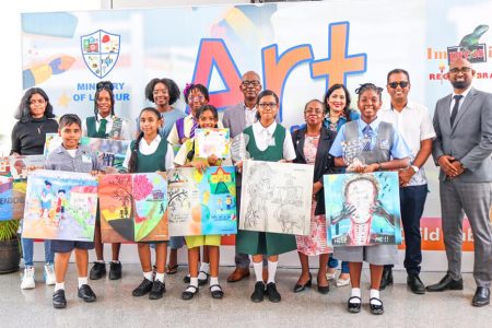 Some of the prize winners with officials of the Ministry of Labour (Ministry of Labour photo)