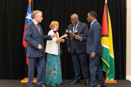 Chile on Tuesday celebrated its 214th anniversary of independence at the Marriott Hotel. In this photo, Chile’s Ambassador Bernardo del Picó  (left) shares a toast with Prime Minister Mark Phillips (second from right), Minister of Foreign Affairs Hugh Todd (right) and Mrs del Picó . (Office of the Prime Minister photo)