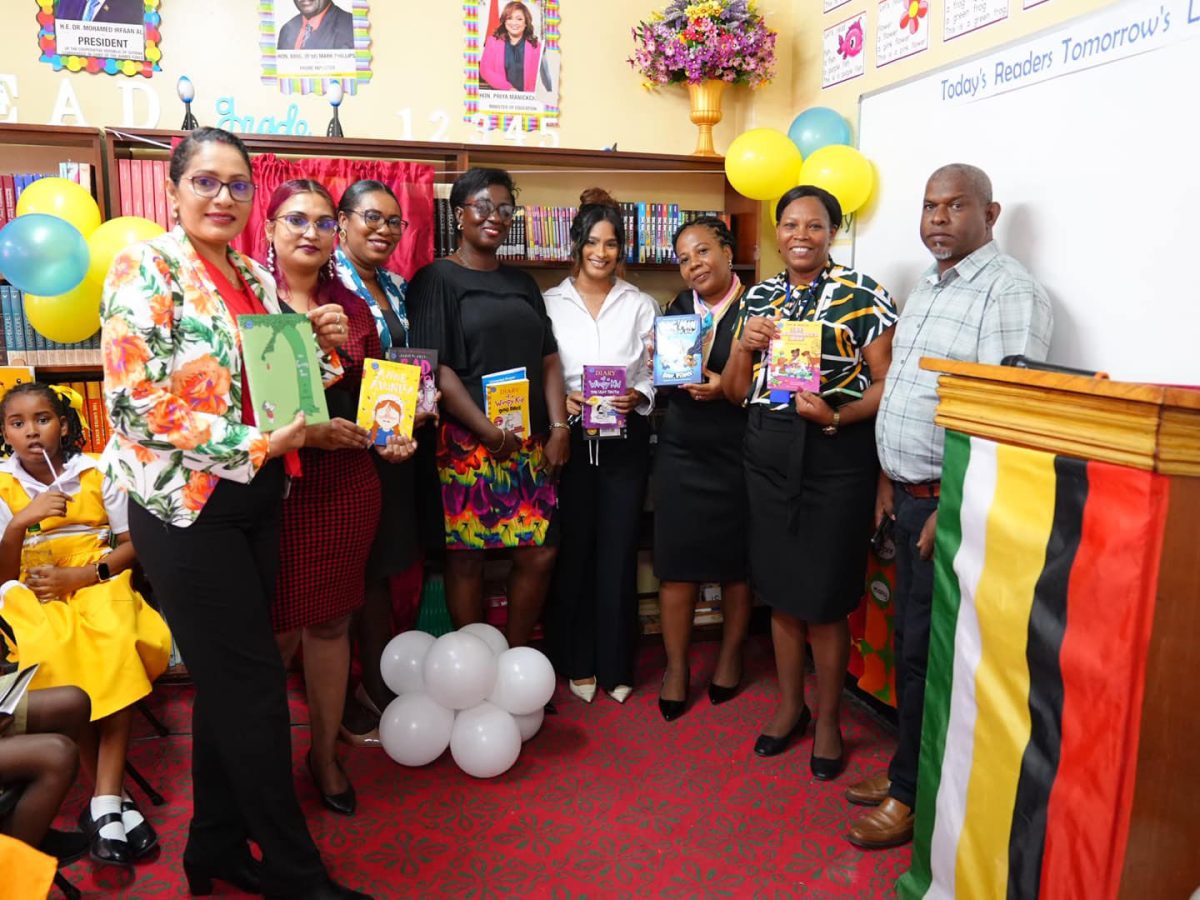 Teachers with some of the books that will be part of the literacy programme. Ministry of Education photo)