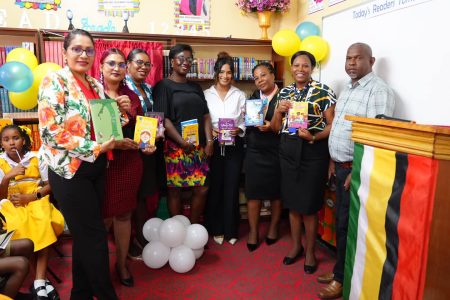 Teachers with some of the books that will be part of the literacy programme. Ministry of Education photo)