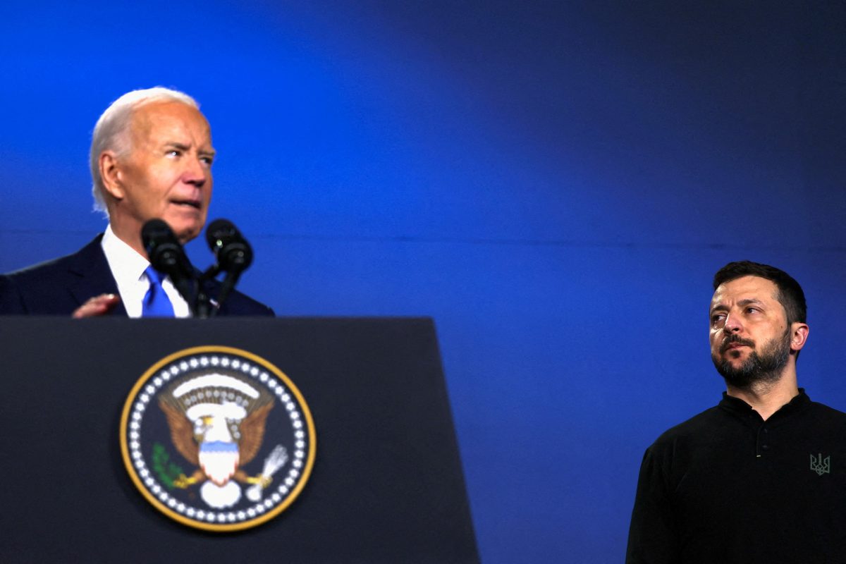 FILE PHOTO: Ukraine’s President Volodymyr Zelenskiy listens to U.S. President Joe Biden speak during a Ukraine Compact meeting, on the sidelines of the NATO’s 75th anniversary summit in Washington, U.S., July 11, 2024. REUTERS/Leah Millis/File Photo