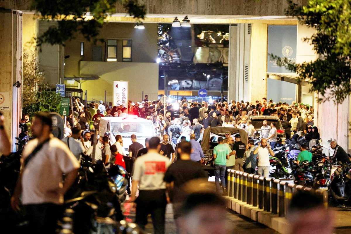 People gather outside American University of Beirut Medical Center (AUBMC) as more than 1,000 people, including Hezbollah fighters and medics, were wounded when the pagers they use to communicate exploded across Lebanon, according to a security source, in Beirut, Lebanon September 17, 2024. REUTERS/Mohamed Azakir 