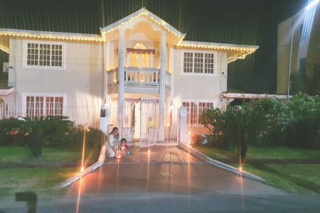 A little girl assist in the lighting of diyas at her Bel Air home
