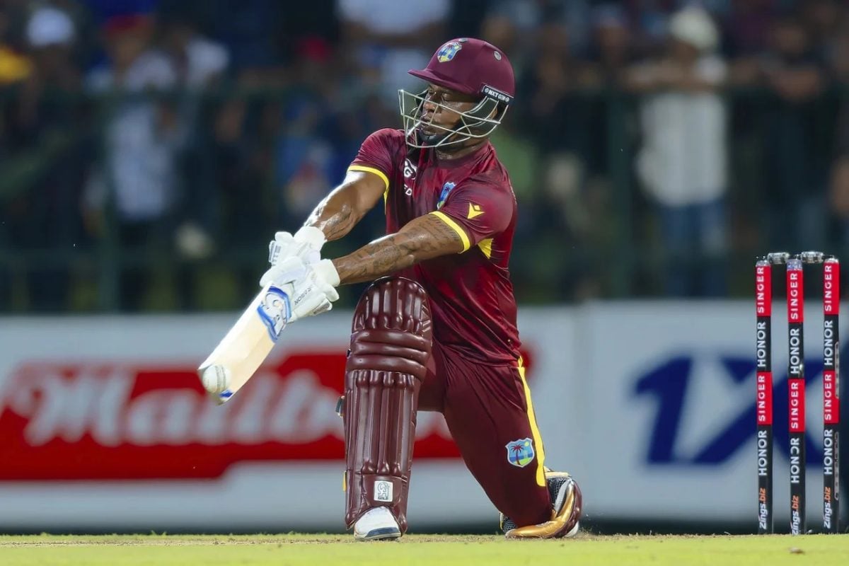 Evin Lewis attempts to sweep during swashbuckling innings of 102 from 61 deliveries (ESPN Cricinfo Photo)