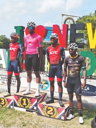 Jamual John (centre) stands atop the podium after capturing the first stage of the inaugural One Guyana 3-Stage Cycling in Berbice. Standing on the left is Aaron Newton, who was second, while Cortis Dey (2nd from right) rounded out the top three. Finishing in fourth was Briton John