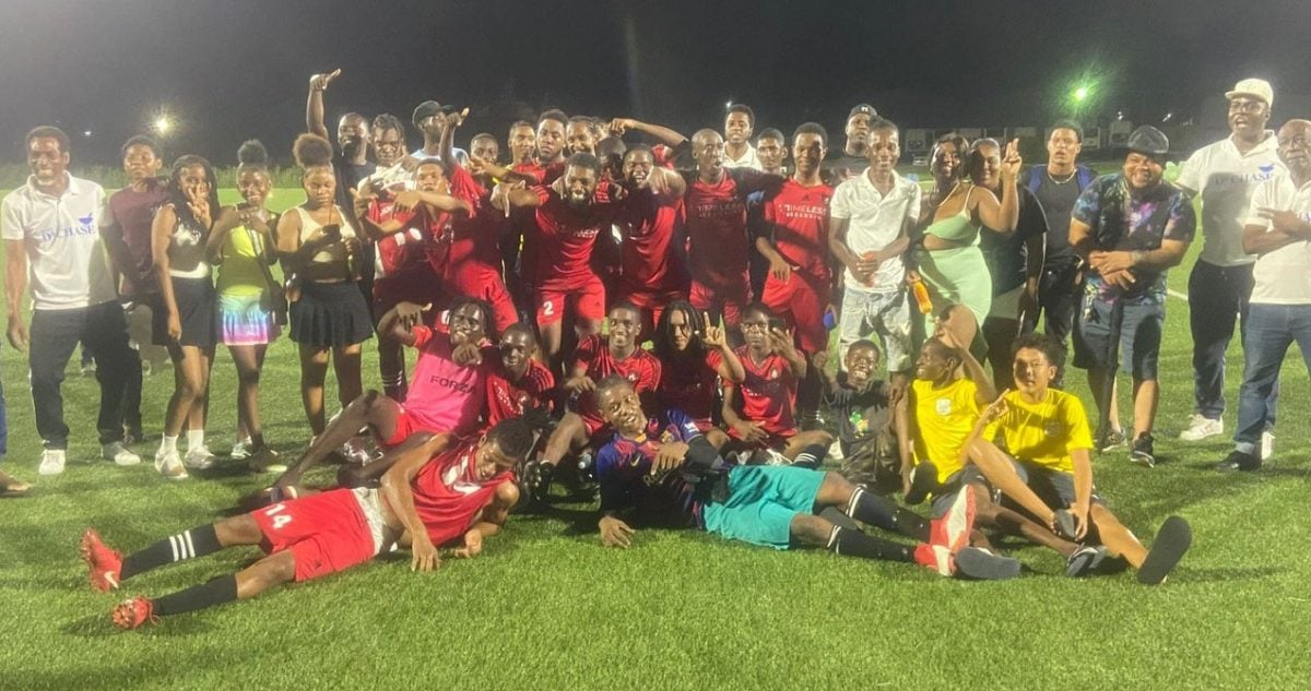 The victorious Agricola Red Triangle unit celebrating with officials and fans of the club after winning the East Bank Demerara Senior Men’s League
