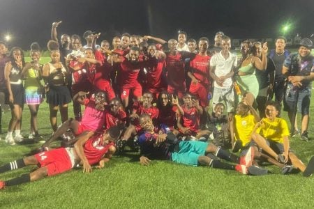 The victorious Agricola Red Triangle unit celebrating with officials and fans of the club after winning the East Bank Demerara Senior Men’s League
