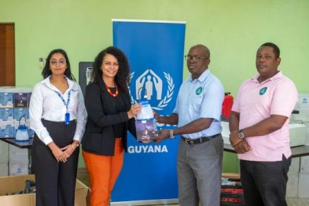 UNHCR’s Head of Office in Guyana, Adriana Negry (seated left), and Deputy Director General of the CDC, Lieutenant Colonel Mark Thomas (seated right), at the signing of the Memorandum of Understanding  