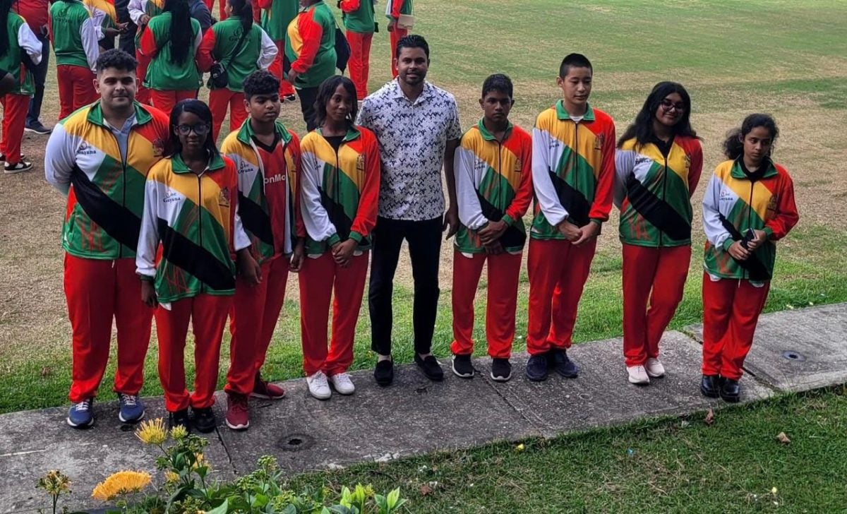 The Guyanese junior chess teams pose for a photo with Minister of
Culture, Youth & Sport Charles Ramson Jr. prior to their departure.