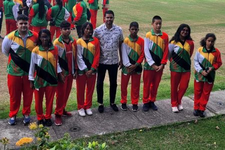 The Guyanese junior chess teams pose for a photo with Minister of
Culture, Youth & Sport Charles Ramson Jr. prior to their departure.