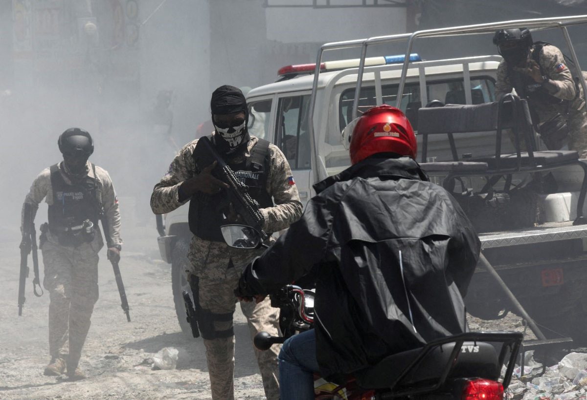 Police officers patrol after dispersing demonstrators, who were calling for help from the government and security forces after gangs attacked neighbourhoods and set houses on fire, in Port-au-Prince, Haiti August 19, 2024. REUTERS/Ralph Tedy Erol/File Photo