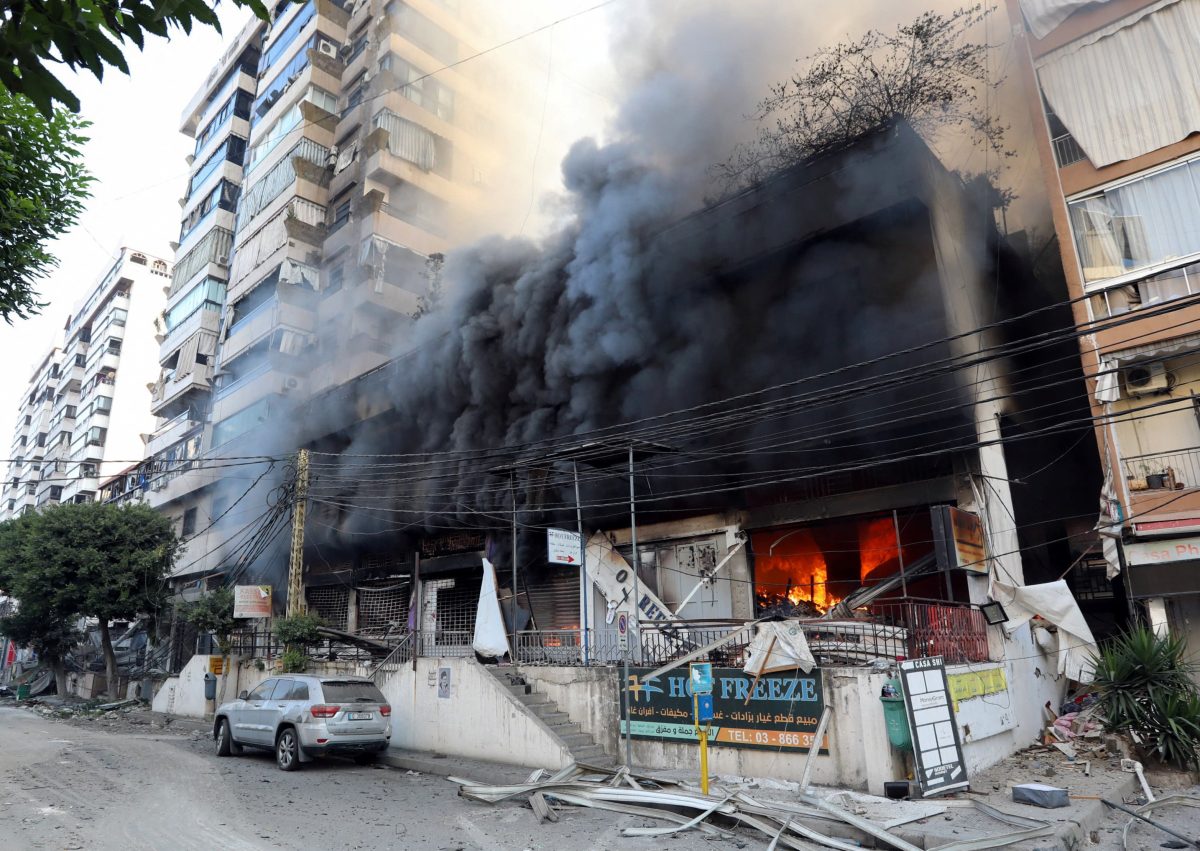 Smoke rises from shops, in the aftermath of Israeli strikes on Beirut’s southern suburbs, amid the ongoing hostilities between Hezbollah and Israeli forces, Lebanon, October 6, 2024. REUTERS/Stringer