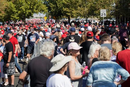 Supporters wait ahead of a campaign rally held by Republican presidential nominee and former U.S. President Donald Trump, in Prescott Valley, Arizona, U.S., October 13, 2024.  REUTERS/Go Nakamura