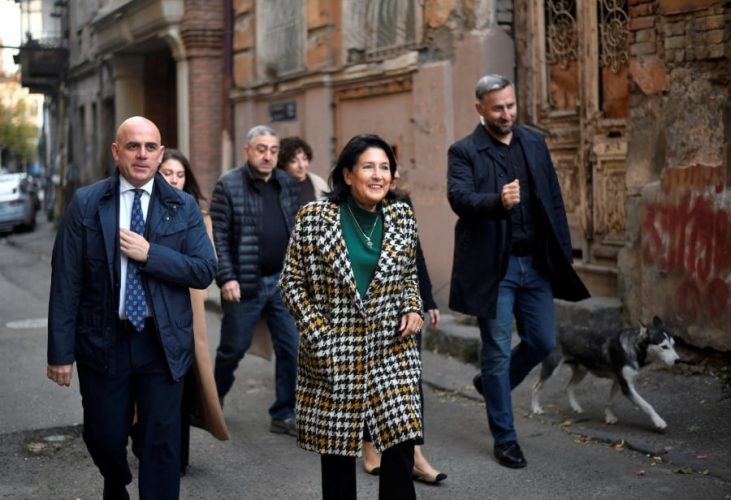 Georgia’s President Salome Zourabichvili (centre) leaves a polling station during parliamentary elections in Tbilisi, Georgia on Saturday. - REUTERS PIC