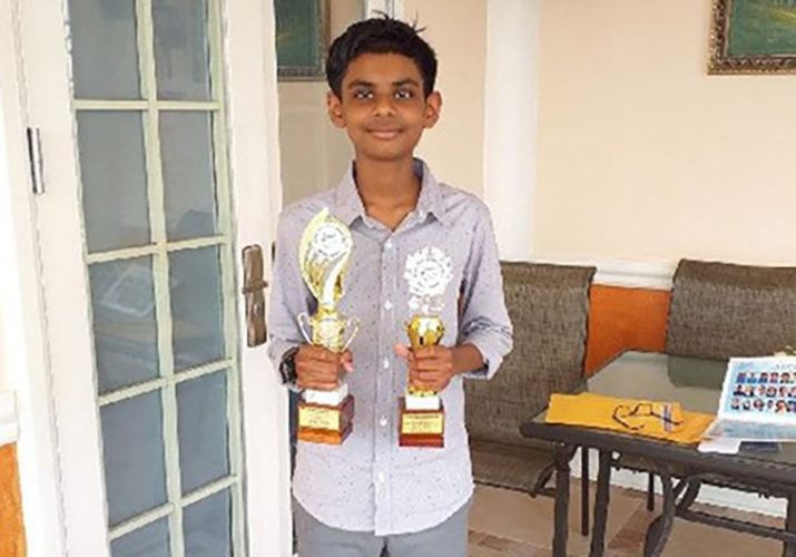 Flashback: Jayden Lalchan displaying trophies he won for academical excellence at St Stephen’s College, Princes Town.