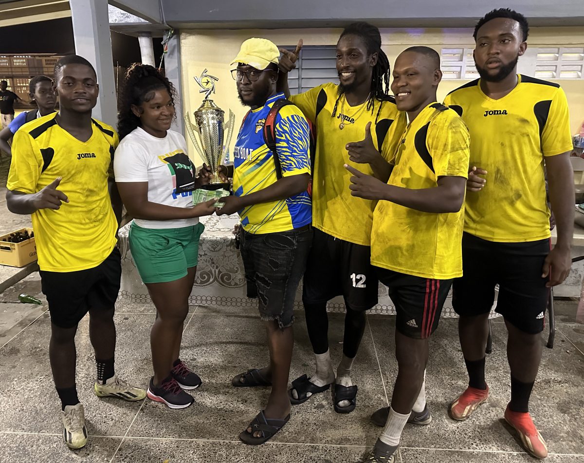 The victorious Jetty Gunners outfit receives their prizes after winning the ‘Rep Ya Turf’ Inter-Block Football Championship
