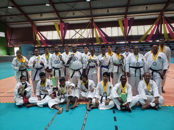 The respective divisional winners and top three finishers pose with their spoils following the conclusion of the Guyana Karate Federation Senior Championship, which was staged at the National Gymnasium, Mandela Avenue.