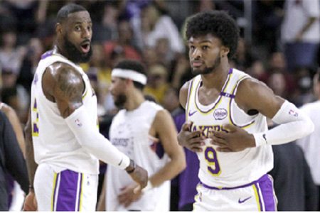 LeBron James (left) and Bronny James. AP Photo/William Liang