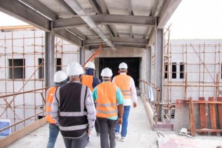 A view of Minister of Health Dr Frank Anthony and others touring the Lima Regional Hospital site