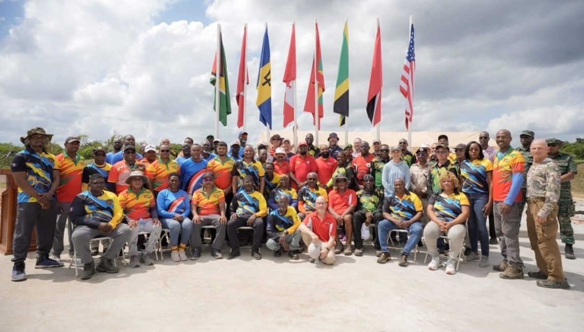 Locked & Loaded! President Irfaan Ali (centre) poses with respective competitors and officials following the launch of the West Indies Fullbore Shooting Championship, which commenced on Monday at the Timehri Rifle Ranges in Yarrowkabra, Linden Soesdyke Highway.