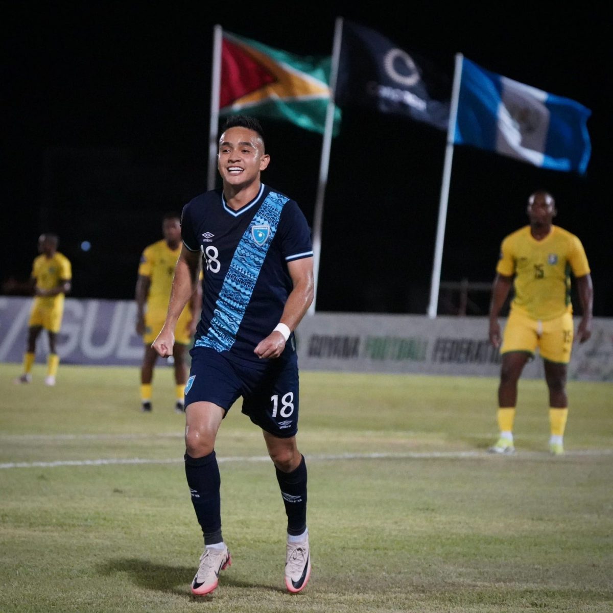 Guatemala’s Oscar Santis celebrates the first of his two goals scored against Guyana at the NTFC, Edinburgh, West Coast Demerara.