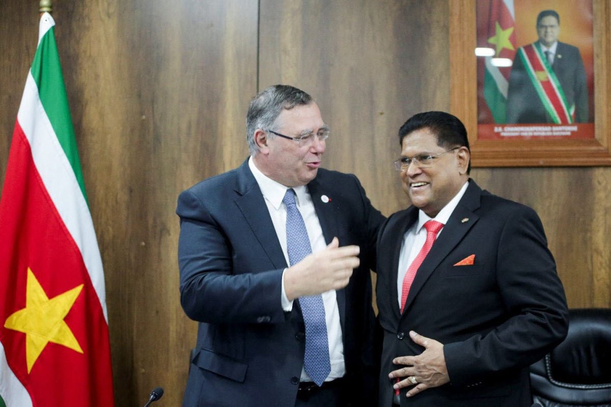 TotalEnergies CEO Patrick Pouyanne and Suriname’s President Chan Santokhi embrace after France’s TotalEnergies and U.S. APA Corp announced a positive investment decision for Suriname’s most promising oil and gas project, Block 58, which is expected to inaugurate the nation’s offshore output, in Paramaribo, Suriname October 1, 2024. REUTERS/Ranu Abhelakh 