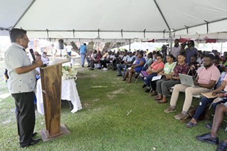 Senior Minister in the Office of the President with Responsibility for Finance and the Public Service, Dr Ashni Singh addressing the gathering at the job fair in Linden, Region Ten