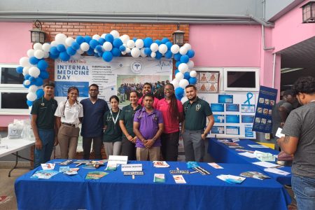 Consultant Specialist Dr Kishore Ramdass along with staff at the mini expo 