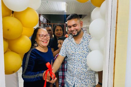 Avishkar Deonarine and Acting Mayor Lorna Fitzallen cutting the ribbon