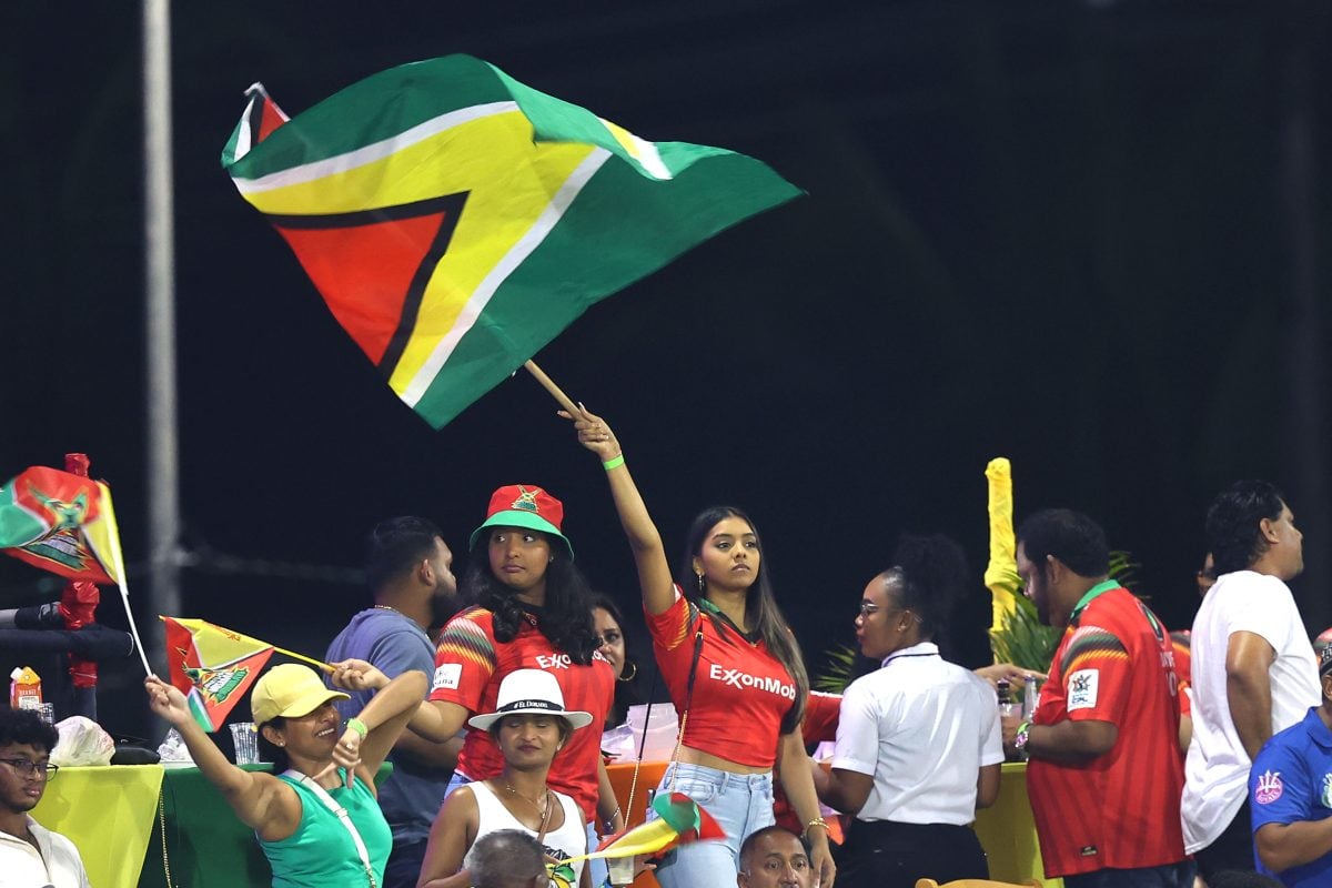 A fan of Guyana Amazon Warriors waves a flag during the Men’s 2024 Republic Bank Caribbean Premier League semi final match between Barbados Royals and Guyana Amazon Warriors at Providence Stadium on October 04, 2024 in Georgetown, Guyana. (Photo by Ashley Allen – CPL T20/CPL T20 via Getty Images)