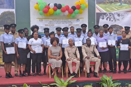 The first batch of 60 prison officers who completed the University of Guyana’s Institute for Human Resiliency, Strategic Security, and the Future (IHRSSF) First Responders Course on Mental, Neurological, and Substance Abuse Disorders (MNS), received their certificate of completion on Wednesday. The proud officers are seen with senior prison officers, including Director of Prison Nicklon Elliot, and other officials. (Guyana Prison Service photo)