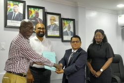 From left are Norris Witter (President, GWU); Dhaneshwar Deonarine (CLO); Deonarain Seepaul (Finance Director) and Kavorn Kyte-Williams (HR Chief Executive/General Counsel) Banks DIH Limited, after the signing of the MoA. (Banks DIH photo) 