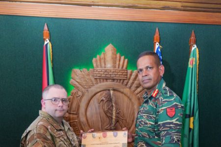 Brigadier Omar Khan (right) with  Lieutenant Colonel (Lt Col) John Oeffinger