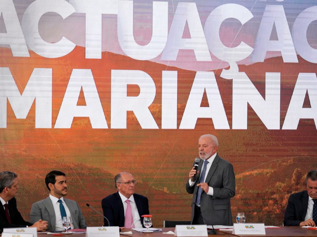 Brazil's President Luiz Inacio Lula da Silva speaks at a signing ceremony of a compensation agreement for damages caused by the 2015 collapse of the Mariana dam [Eraldo Peres/AP Photo]