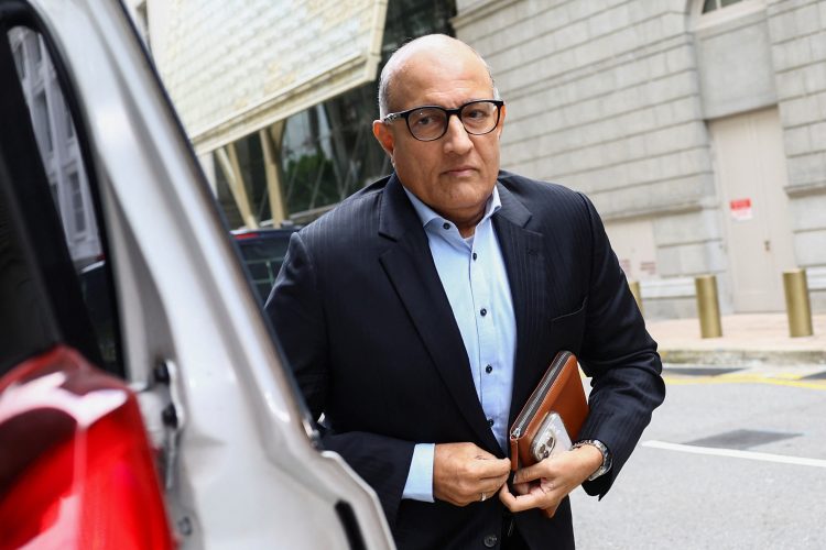 Former transport minister S. Iswaran walks as he appears at the Supreme Court in Singapore October 3, 2024. REUTERS/Edgar Su