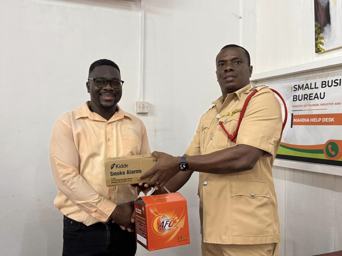 A smoke alarm being handed out during the outreach (Ministry of Home Affairs photo)