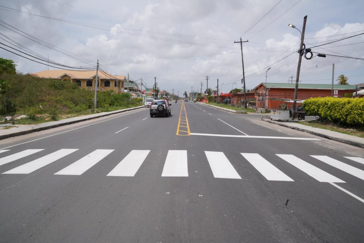 Thermoplastic road painting underway at the Aubrey Barker four-lane expansion project. (Ministry of Public Works photo)