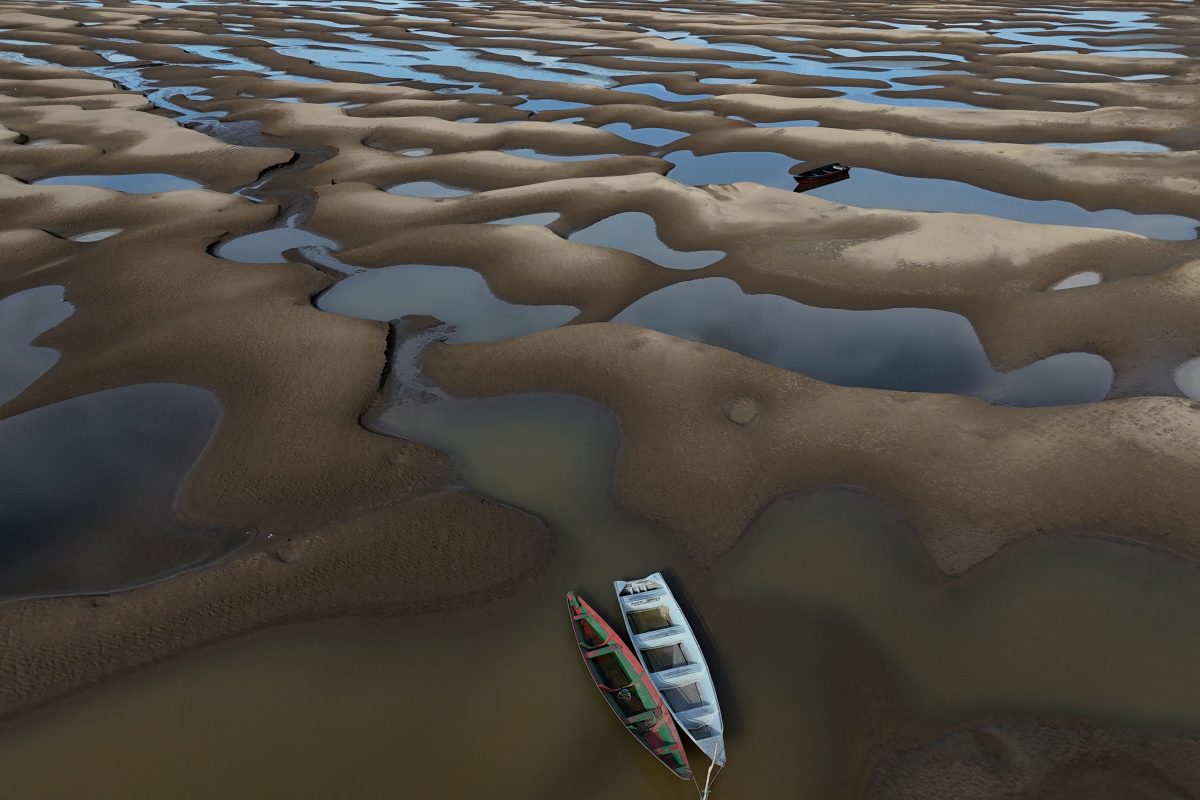 A drone view shows stranded boats over the sandbanks exposed due to drought at the Solimoes River, one of the largest tributaries of the Amazon River, during the most intense and widespread drought Brazil has experienced since records began in 1950, near Manacapuru, Amazonas state, Brazil September 30, 2024. REUTERS/Bruno Kelly