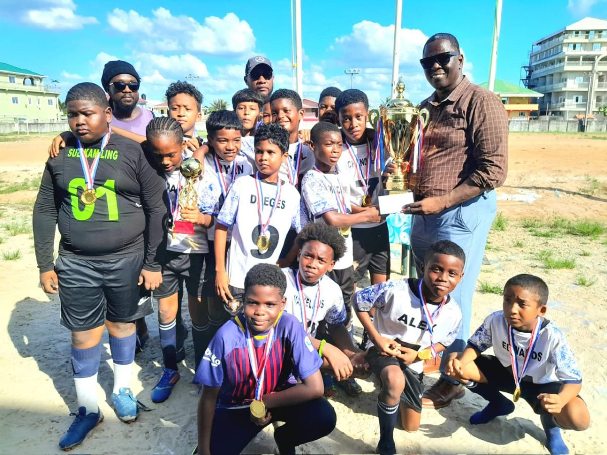 The victorious St. John the Baptist team receives their spoils after
winning the Bartica Primary Schools Football Championship.