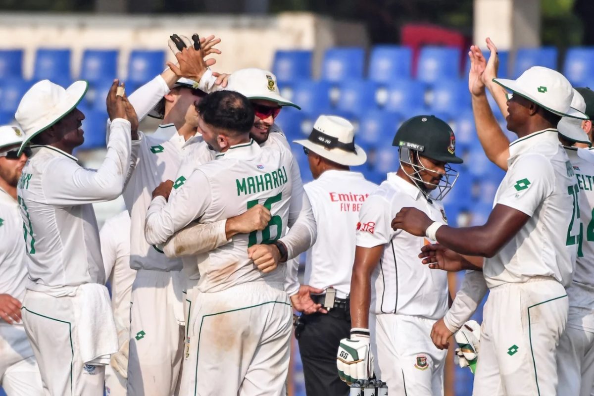 Keshav Maharaj is congratulated by teammates following a dismissal, as he finished with figures of 5-59 to lead South Africa to victory (ESPN Cricinfo Photo).