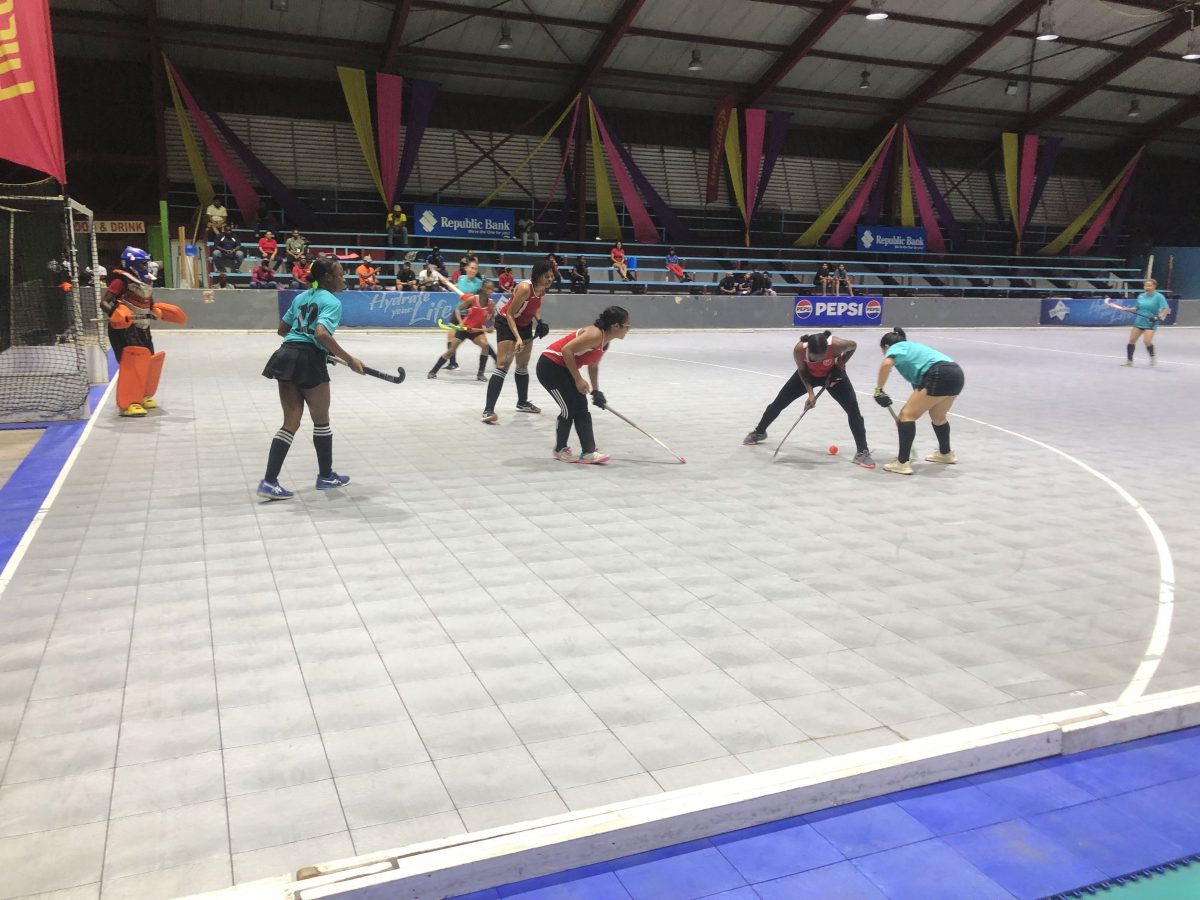 Part of the action in the Diamond Mineral Water International Hockey Festival between GCC (aquamarine) and Old Fort