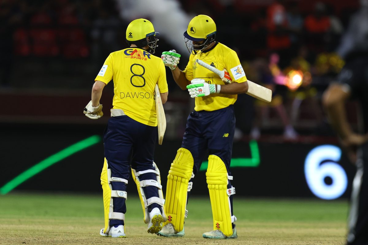 Liam Dawson and Shan Masood rejoice after
successfully chasing 12 runs to defeat the Rangpur Riders in a Super Over (GSLT20 Photo)