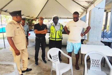 Members of the police force and others during the visit to the family of Salima Heeralal (Police photo)