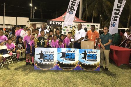 The victorious Santa Rosa unit receives the championship trophy after defeating Marian Academy in the final of the Courts Pee Wee U-11 Football Championship.