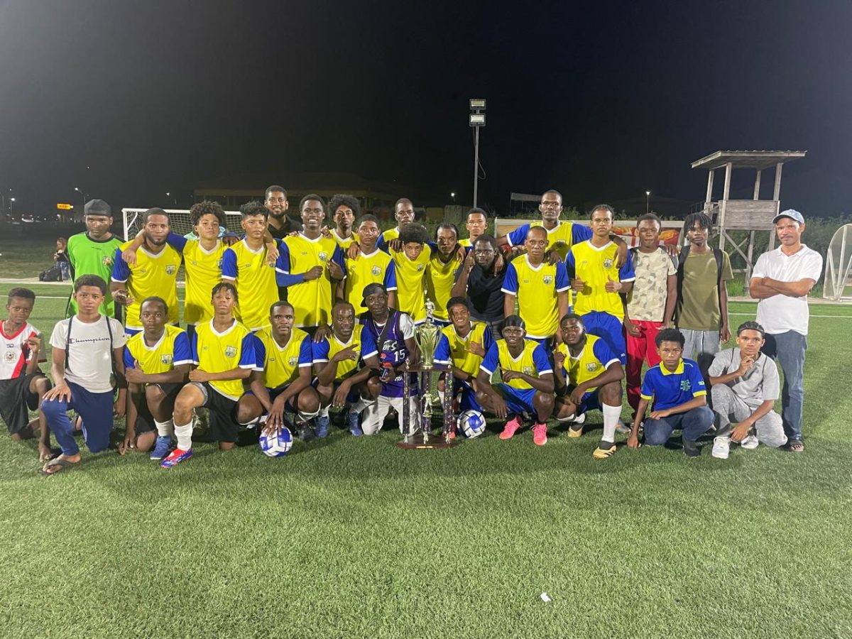 Newly crowned Georgetown League champion Pele posing with their title following the conclusion of the tournament
