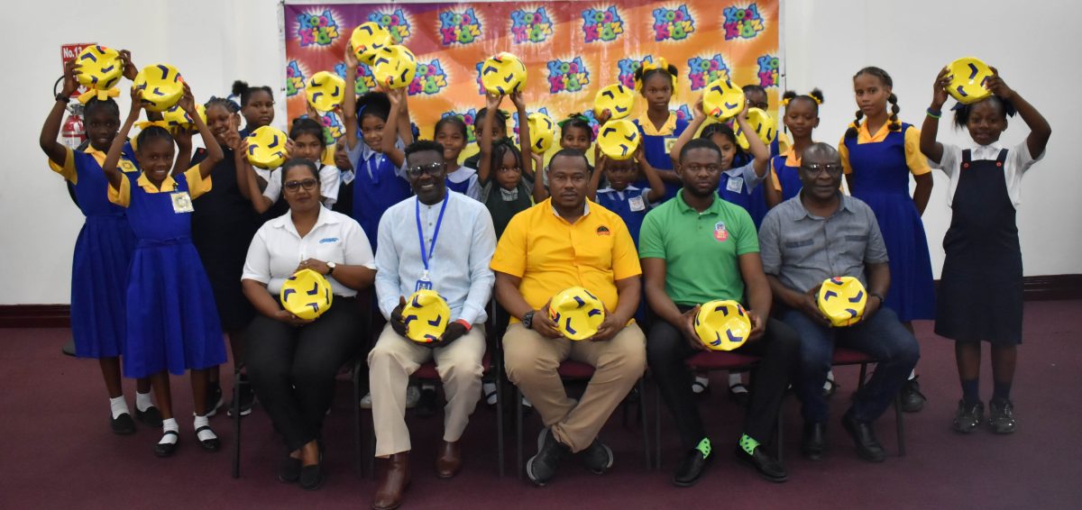 Representatives from the competing schools display their respective balls following the conclusion of the distribution exercise
