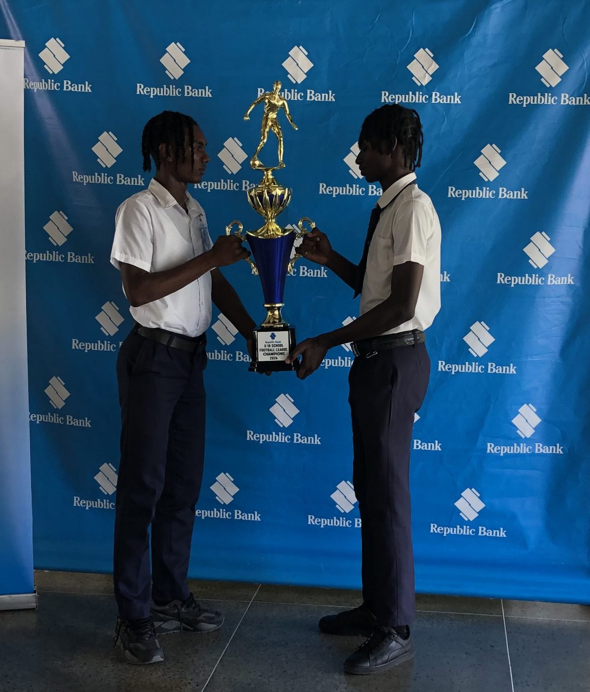 Faceoff! Chase Academy captain Bryan Wharton (left) and Dolphin Secondary skipper Brian Brower face-off ahead of their clash on Sunday, which could be considered a virtual final in the Republic Bank U-18 Schools Football League 