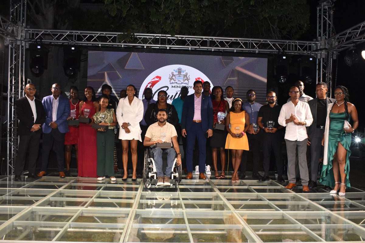 Minister of Culture, Youth and Sport, Charles Ramson Jr. (centre) posed with the  winners at the
conclusion of the National Sports Awards ceremony. (Ministry of Culture, Youth and Sport photo)